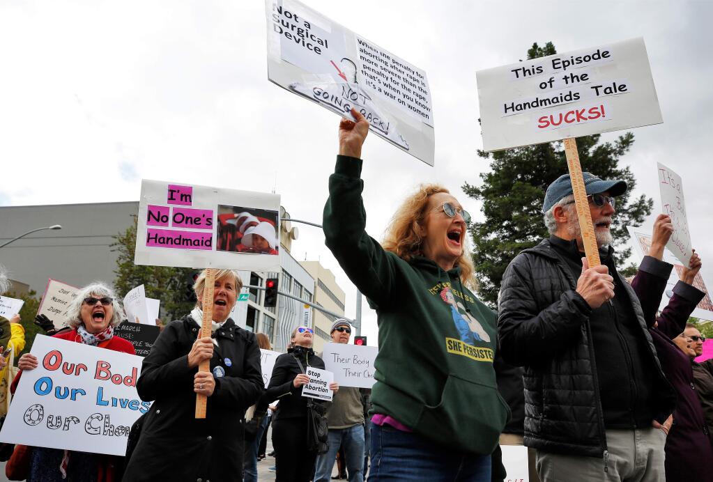 From far right: Phil and Ruth Hansten, Pat Bakalian, and Becky Montgomery chant with other demonstrators during the Stop the Ban rally held in protest to anti-abortion laws being passed in other states, at Old Courthouse Square in Santa Rosa, California, on Tuesday, May 21, 2019. (Alvin Jornada / The Press Democrat)