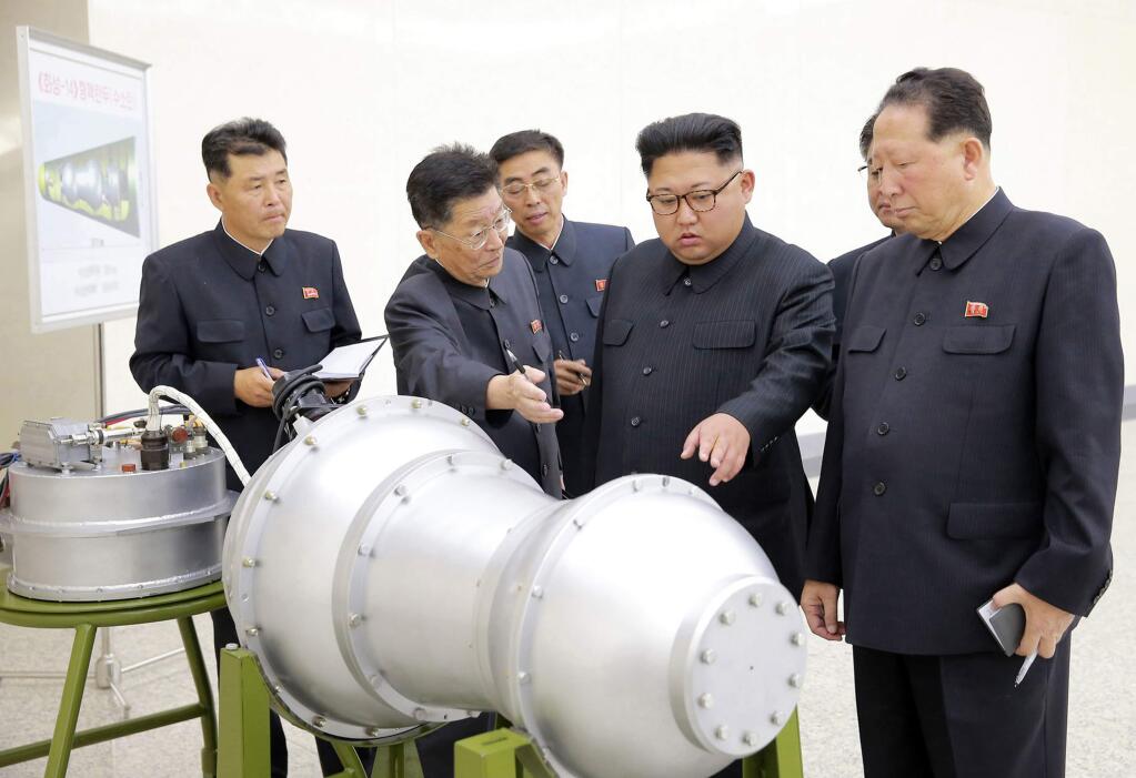 FILE - This undated file photo distributed on Sept. 3, 2017, by the North Korean government, shows North Korean leader Kim Jong Un, second from right, at an undisclosed location in North Korea. Foreign journalists will journey into the mountains of North Korea this week to observe the closing of the country's nuclear test site, a display of goodwill ahead of leader Kim Jong Un's planned summit with President Donald Trump. (Korean Central News Agency/Korea News Service via AP, File)