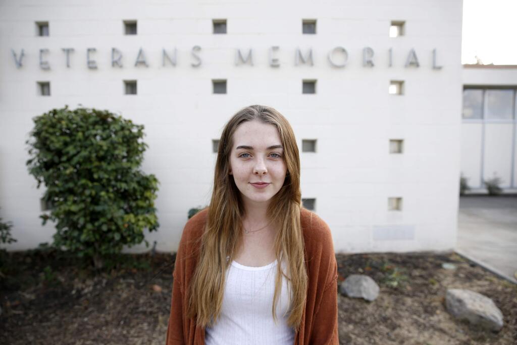 Paige Williams, 15, helped to organize the fire evacuation site at the Veteran's Memorial Hall in Petaluma. Photo taken on Thursday, November 9, 2017. (BETH SCHLANKER/ The Press Democrat)