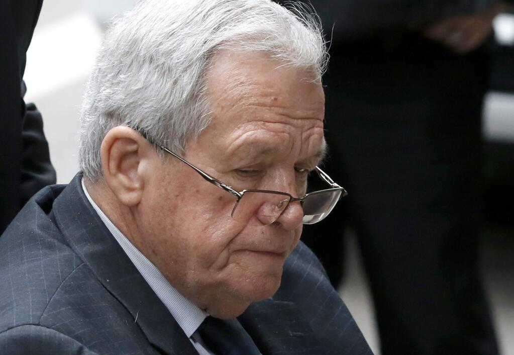 Former House Speaker Dennis Hastert departs the federal courthouse in Chicago after his sentencing Wednesday on federal banking charges. (CHARLES REX ARBOGAST / Associated Press)