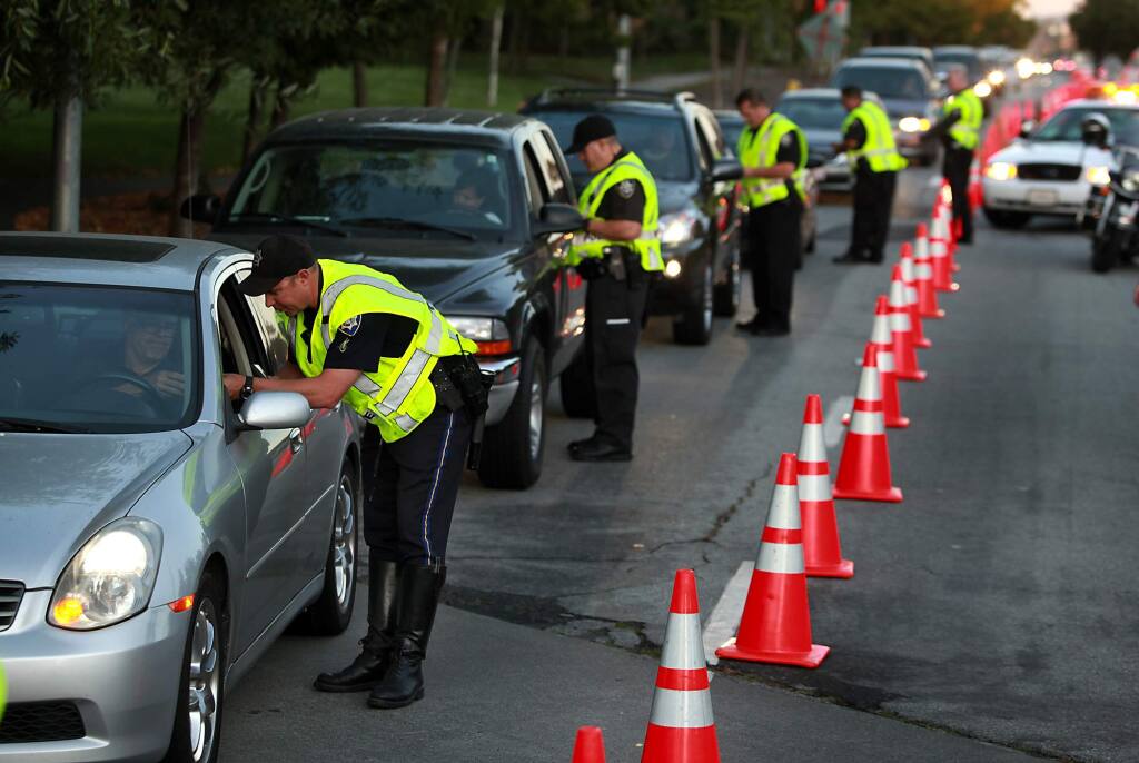 Police stop vehicles during a DUI checkpoint in Petaluma in 2011. (KENT PORTER/ PD FILE)