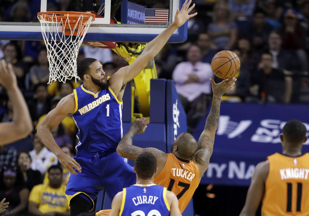 Golden State Warriors' JaVale McGee (1) goes up for a block on shot from Phoenix Suns' P.J. Tucker during the first half Sunday, Nov. 13, 2016, in Oakland. (AP Photo/Marcio Jose Sanchez)