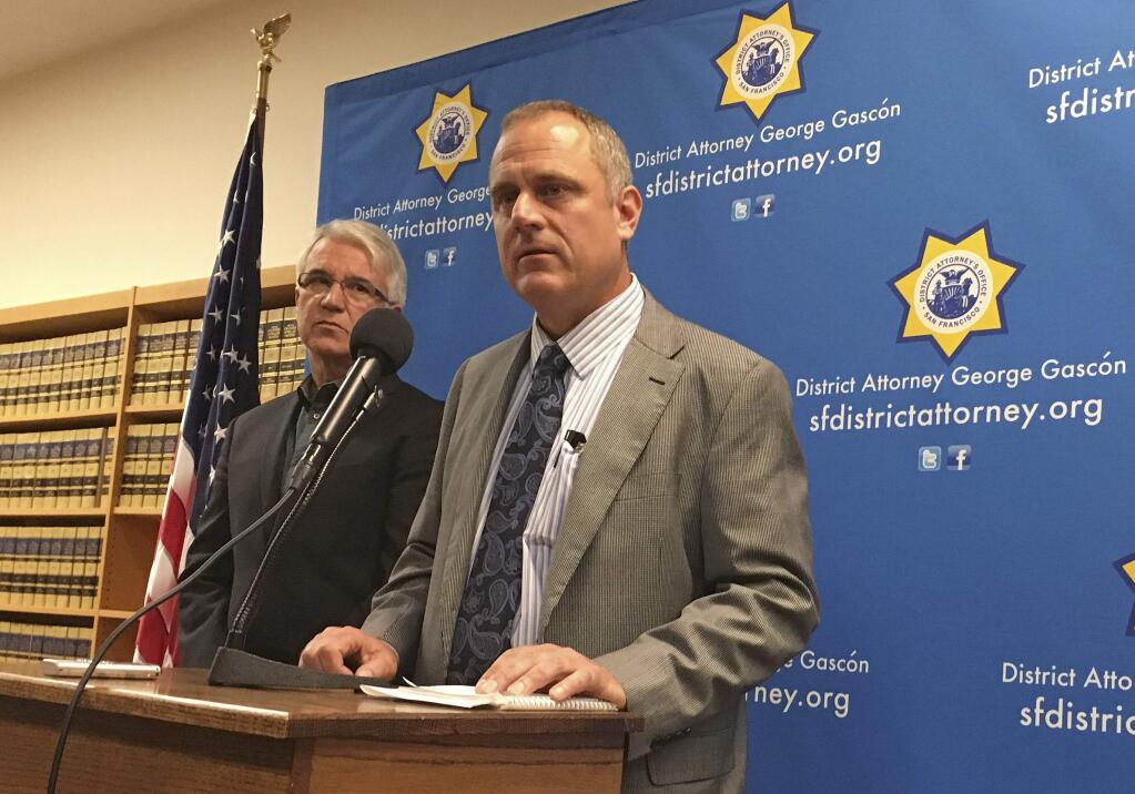 In this photo taken Tuesday, Nov. 1, 2016, San Francisco District Attorney George Gascon, left, and elections director John Arntz, right, discuss election security during a news conference in San Francisco. Officials throughout California are sending the message that despite talk of dirty politics, the state has a clean elections process with few instances of confirmed voter fraud. (AP Photo/Janie Har)