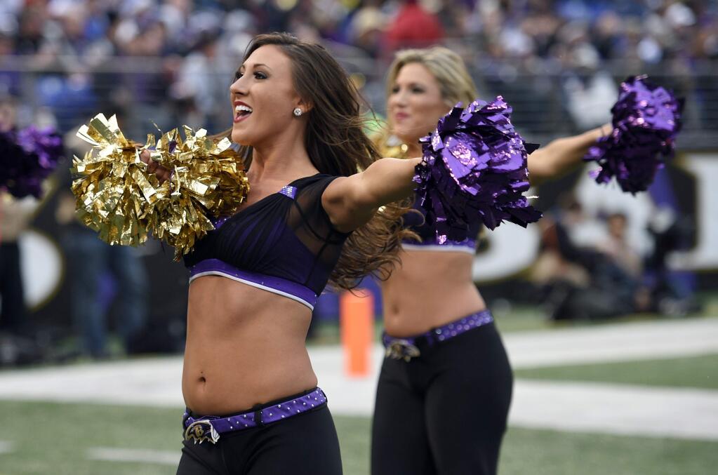 Baltimore Ravens cheerleaders perform during an NFL football game against the Cleveland Browns, Sunday, Dec. 28, 2014, in Baltimore. (AP Photo/Nick Wass)