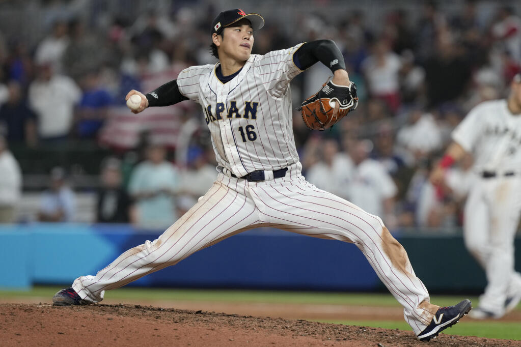 Japan pitcher Shohei Ohtani aims a pitch during the ninth inning of the World Baseball Classic final against the U.S., Tuesday, March 21, 2023, in Miami. Japan defeated the U.S. 3-2. (Marta Lavandier / ASSOCIATED PRESS)