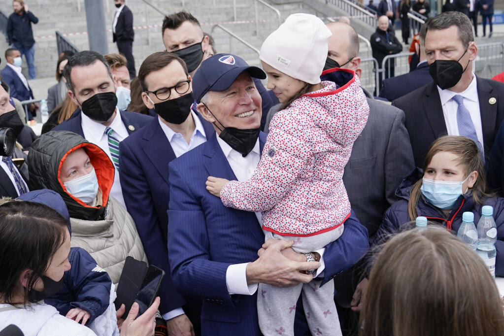 FILE - President Joe Biden meets with Ukrainian refugees during a visit to PGE Narodowy Stadium, Saturday, March 26, 2022, in Warsaw. Biden turns 80 on Sunday, Nov. 20. (AP Photo/Evan Vucci, File)