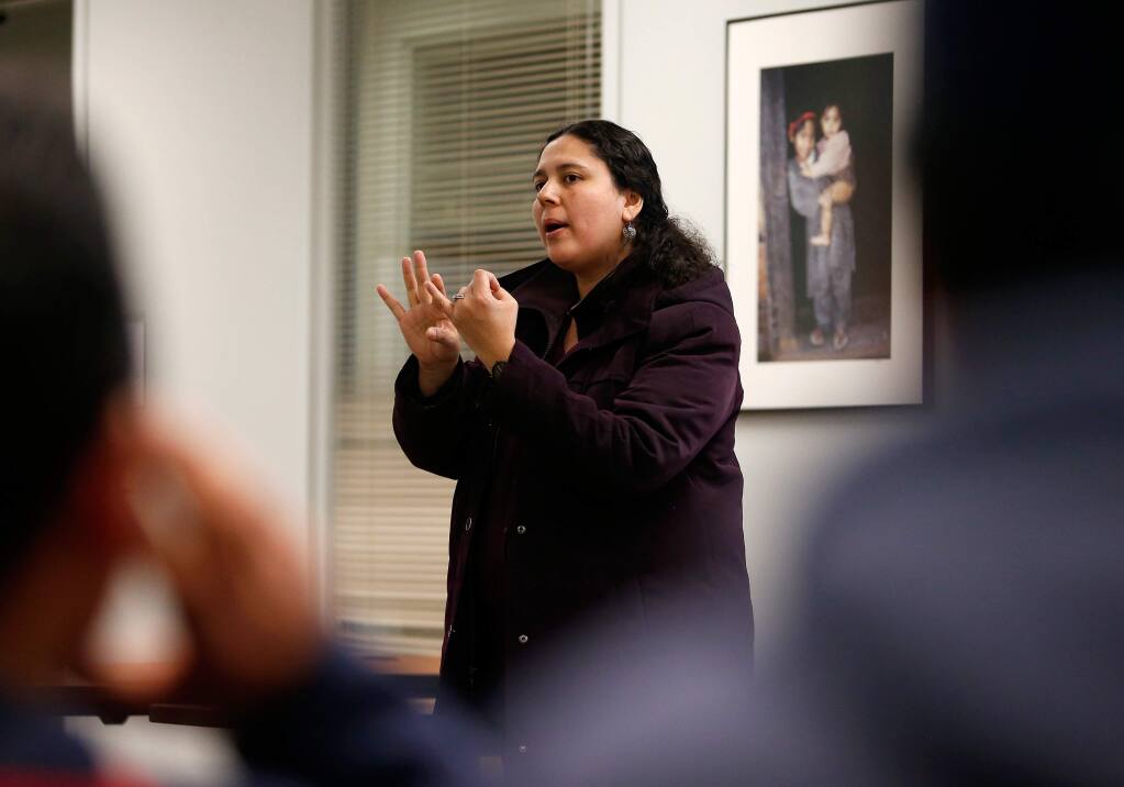 Catholic Charities' Board of Immigration Appeals (BIA) accredited immigration representative Marcela Morales gives a seminar to a group of undocumented Sonoma County residents about their civil rights and facing the possibility of deportation, at Catholic Charities in Santa Rosa, California on Wednesday, February 22, 2017. (Alvin Jornada / The Press Democrat)