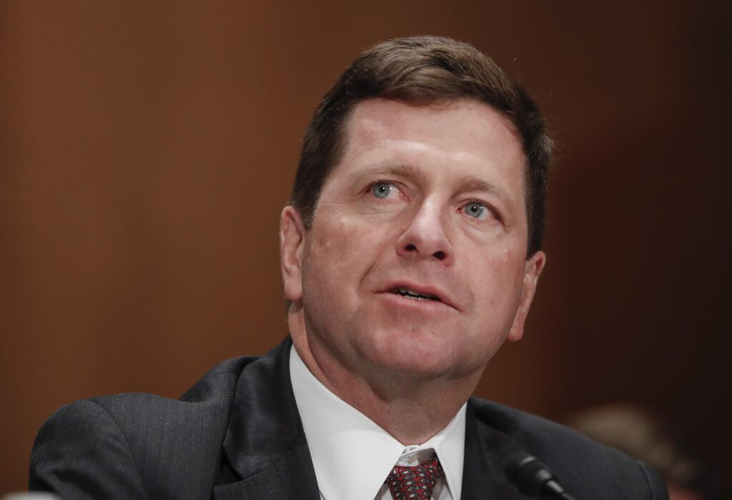 FILE- In this March 23, 2017, file photo, Securities and Exchange Commission (SEC) Chairman nominee Jay Clayton testifies on Capitol Hill in Washington at his confirmation hearing before the Senate Banking Committee. The SEC says a cyber breach of a filing system it uses may have provided the basis for some illegal trading in 2016. In a statement posted Wednesday, Sept. 20, evening on the SEC's website, Clayton says a review of the agency's cybersecurity risk profile determined that the previously detected “incident” was caused by “a software vulnerability” in its EDGAR filing system. (AP Photo/Pablo Martinez Monsivais, File)