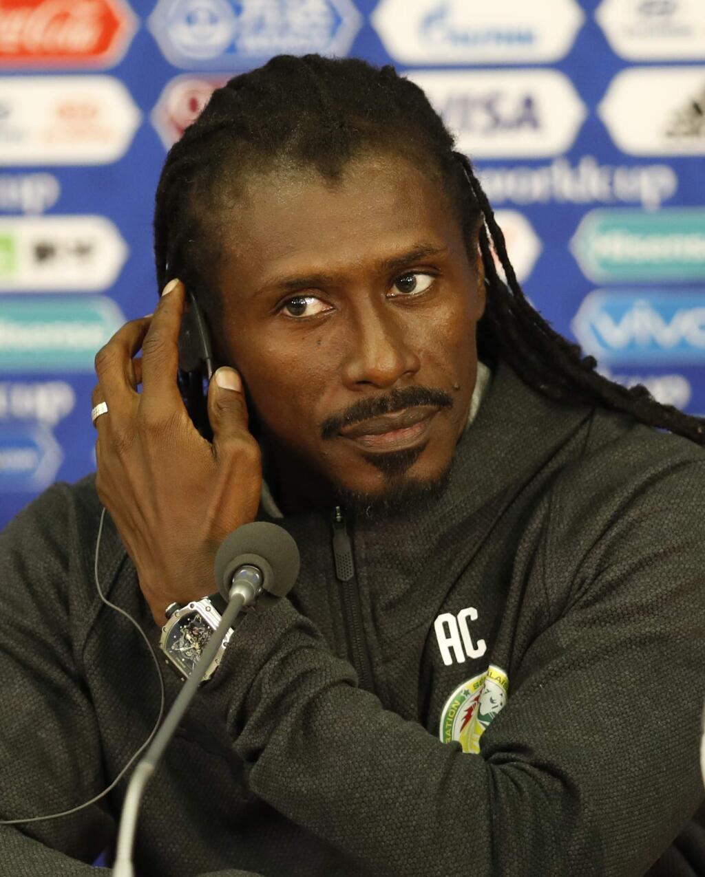 Senegal coach Aliou Cisse attend a press conference before Senegal's official training on the eve of the group H match between Poland and Senegal at the 2018 soccer World Cup in the Spartak Stadium in Moscow, Russia, Monday, June 18, 2018. (AP Photo/Eduardo Verdugo)