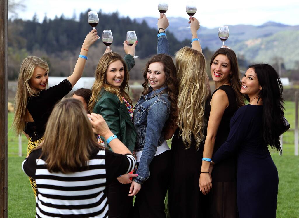 College friends from SSU and SRJC pose for a picture at Truett Hurst in the Dry Creek Valley during Wine Road Barrel Tasting in March. (John Burgess / PD file 2014)