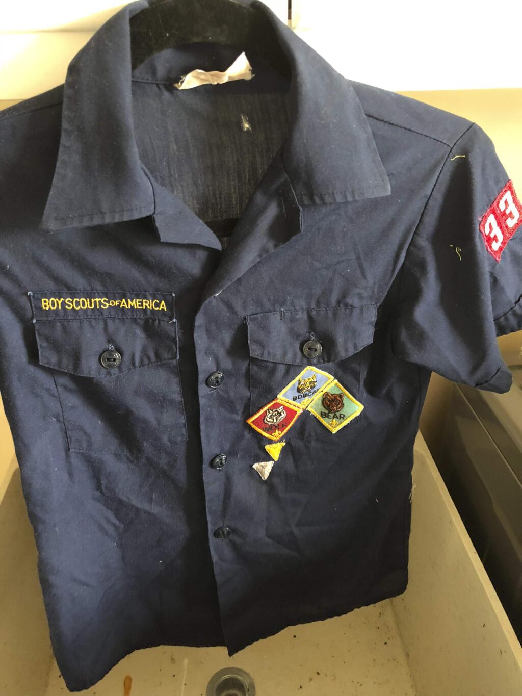 This Feb. 13, 2018, photo provided by Erin Doherty shows the Boy Scout uniform of a Montecito, Calif., mudslide victim, believed to be dead, after Doherty found and cleaned it before giving it to the boy's mother. Months after the mudslides nearly wiped the small community of Montecito off the map and killed multiple people, those who survived are still looking for and finding their belongings in the deep and hardened sludge. (Erin Doherty via AP)