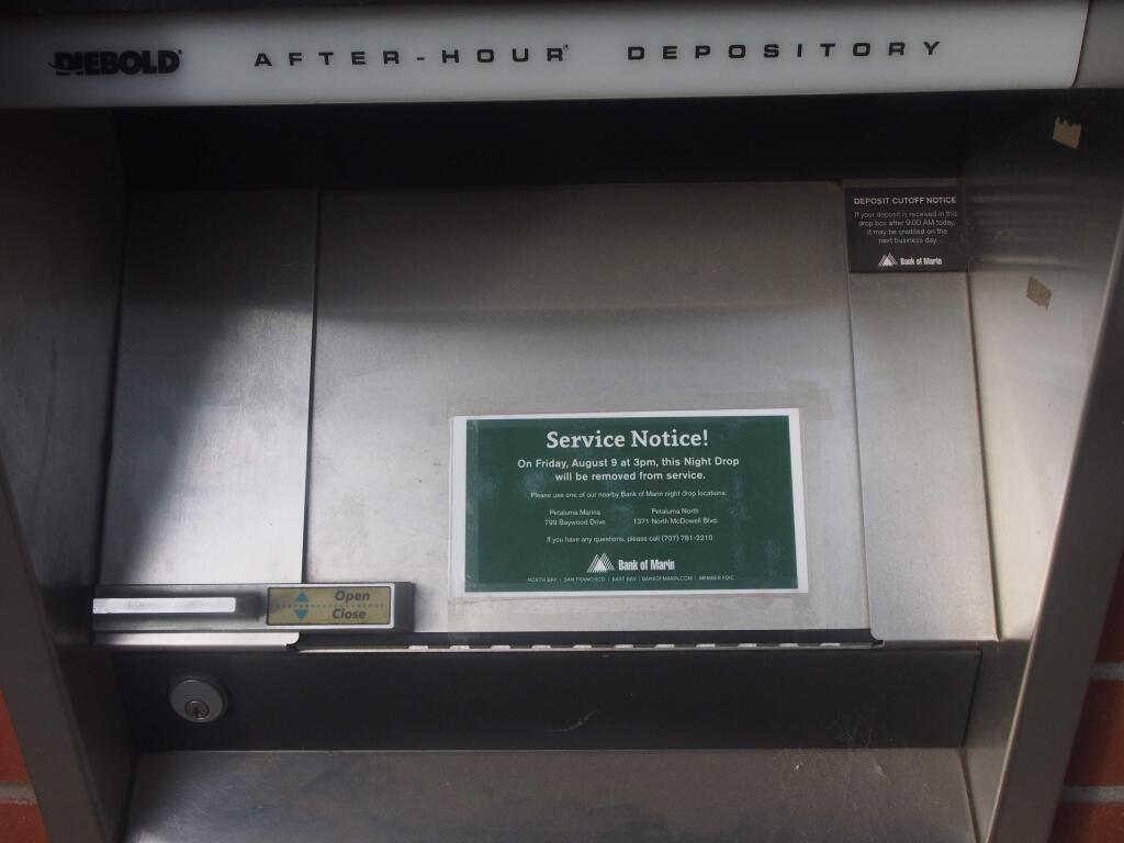 Bank of Marin posts a notice that its night deposit box, seen here in July 2019, at the downtown Petaluma branch will close Aug. 9, 2019. (Chase DiFeliciantonio / North Bay Business Journal)