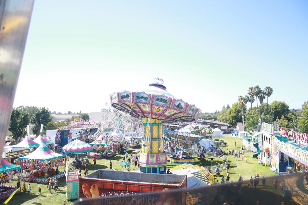 View from above: The Century Ferris Wheel at the Sonoma County Fair offered panoramic views of the carnival. It costs five tickets to ride the wheel, and take in the scenery of the 48th annual event. (Ashlee Ruggels / The Press Democrat)