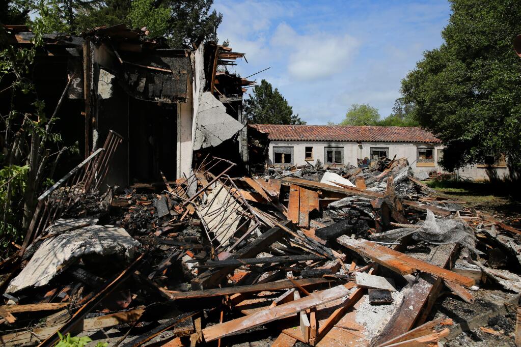 A fire severely damaged a large boarded-up structure near St. Eugene's Catholic Church in Santa Rosa, California on Monday, April 20, 2020. (BETH SCHLANKER/ The Press Democrat)