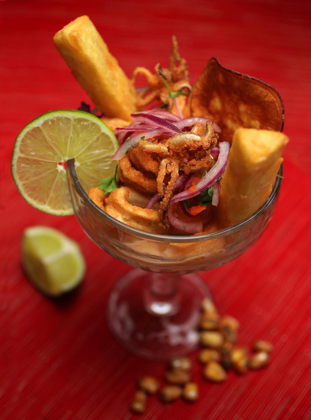 Ceviche de Leche de Tigre con Jalea with fried calamari, tilapia ceviche with ginger, garlic, celery and pickled onion served with fried yuca from chef/owner Jose Navarro of Sazon Peruvian Cuisine in Santa Rosa. (photo by John Burgess/The Press Democrat)