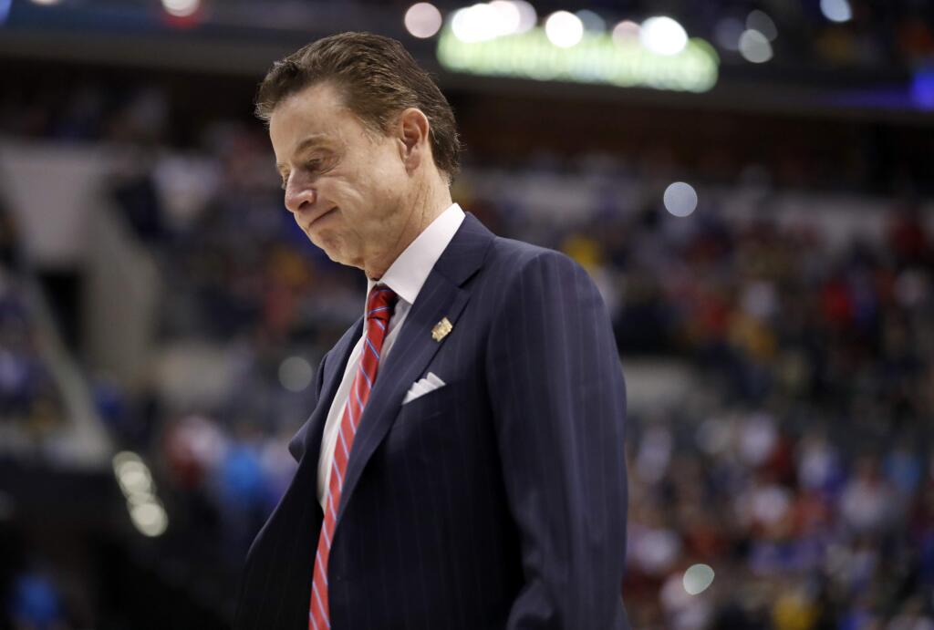 Louisville head coach Rick Pitino walks off the court after a 73-69 loss to Michigan in a second-round game in the men's NCAA tournament Sunday, March 19, 2017, in Indianapolis. (AP Photo/Jeff Roberson)