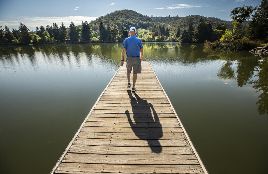 Ralph Harms built a house just a few blocks from an entrance to Spring Lake Regional Park in Santa Rosa 36 years ago to be near its running trails. Two days before his scheduled death with dignity, Ralph takes one last fast-paced long walk around his chosen spot. (John Burgess/The Press Democrat) SMALLER PHOTO