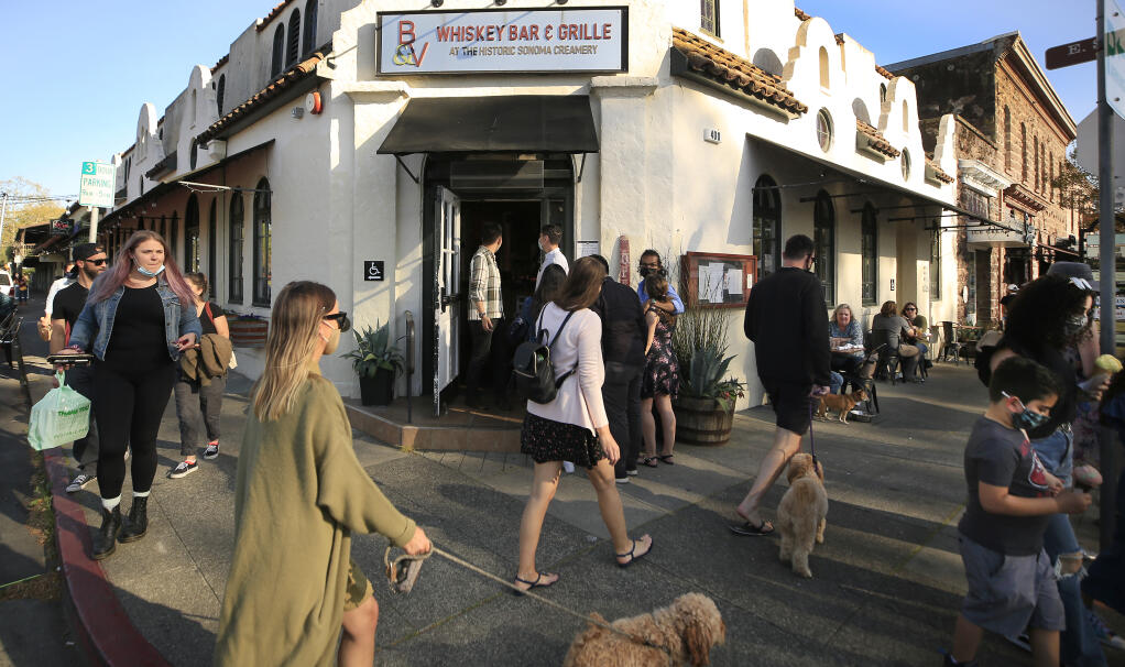 Foot traffic is brisk in downtown Sonoma, Saturday, April 10, 2021.  As the pandemic begins to wane and Sonoma County moves to less restrictive tiers, tourism has shown a marked increase.  (Kent Porter / The Press Democrat) 2021