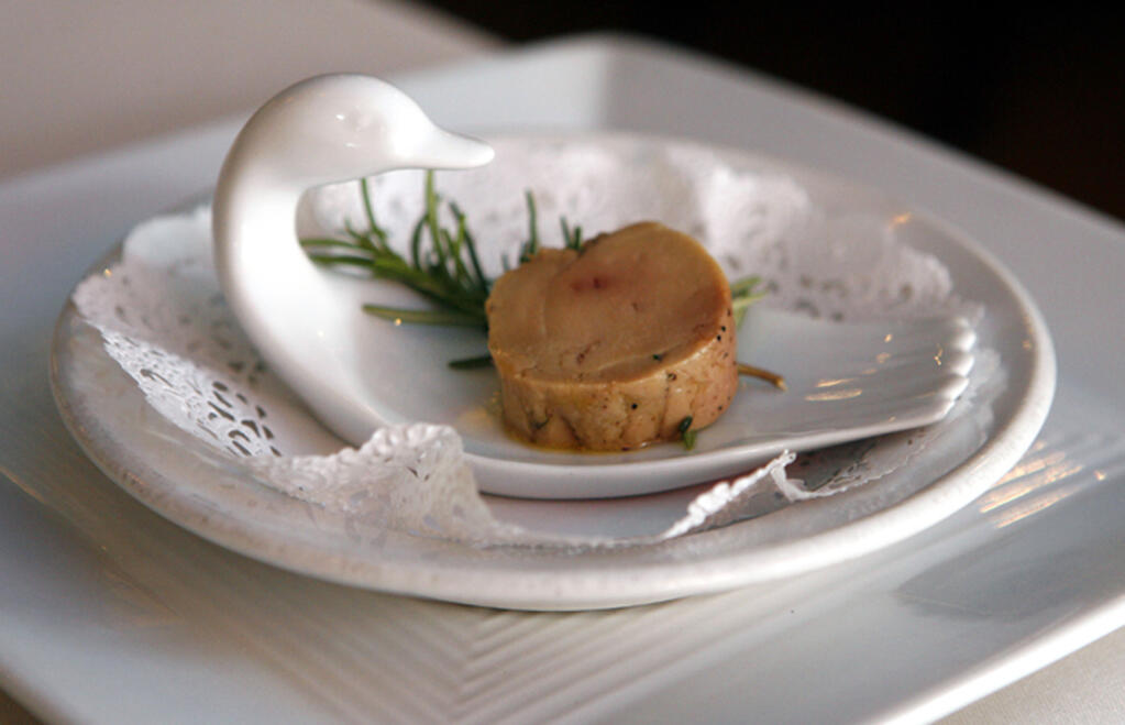 FILE - A serving of salt-cured fresh foie gras with herbs is displayed at Chef Didier Durand's Cyrano's Bistrot and Wine Bar in Chicago, Aug. 9, 2006. The Supreme Court is leaving in place a lower court ruling against duck liver lovers, declining Monday, May 22, 2023, to step in and hear a dispute over a California law that bars foie gras from being sold in the state. (AP Photo/M. Spencer Green, File)