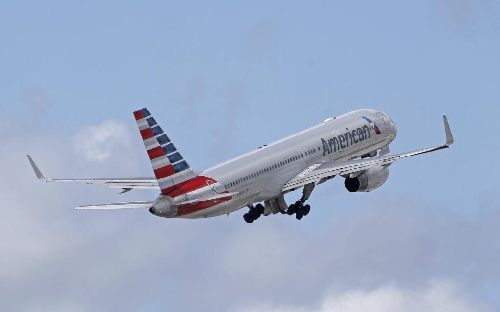 FILE - In this Friday, June 3, 2016 file photo, an American Airlines passenger jet takes off from Miami International Airport in Miami. American and United have started selling cheaper 'basic economy' fares as they battle discount airlines for the most budget-conscious travelers, announced Tuesday, Feb. 21, 2017. (AP Photo/Alan Diaz)