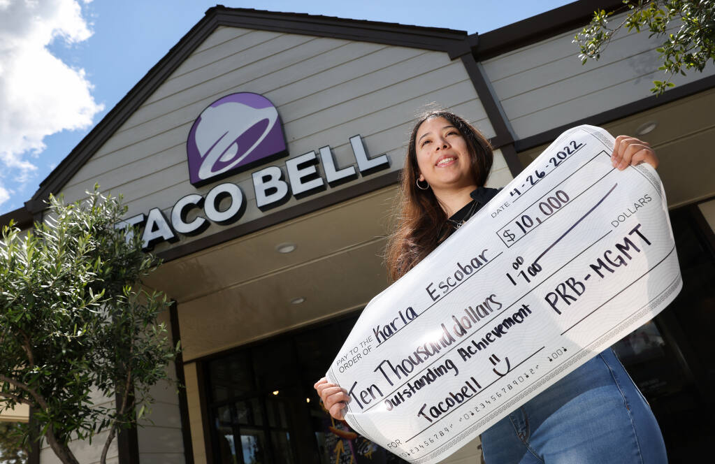 Santa Rosa Junior College freshman Karla Escobar received a scholarship from the Taco Bell Foundation in April. Escobar is studying criminal justice, and entrepreneurship, at SRJC.  Escobar is photographed in front of the Taco Bell in Sonoma where she works, on Tuesday, May 10, 2022.  (Christopher Chung/The Press Democrat)