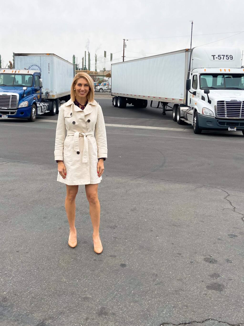 Alicia Yandell Hamilton, vice president of Yandell Truckaway, Yandell Logistics and SW Warehouses, stands in front of affiliated trucks outside the Benicia offices and warehouse on Nov. 26, 2019. (courtesy photo)