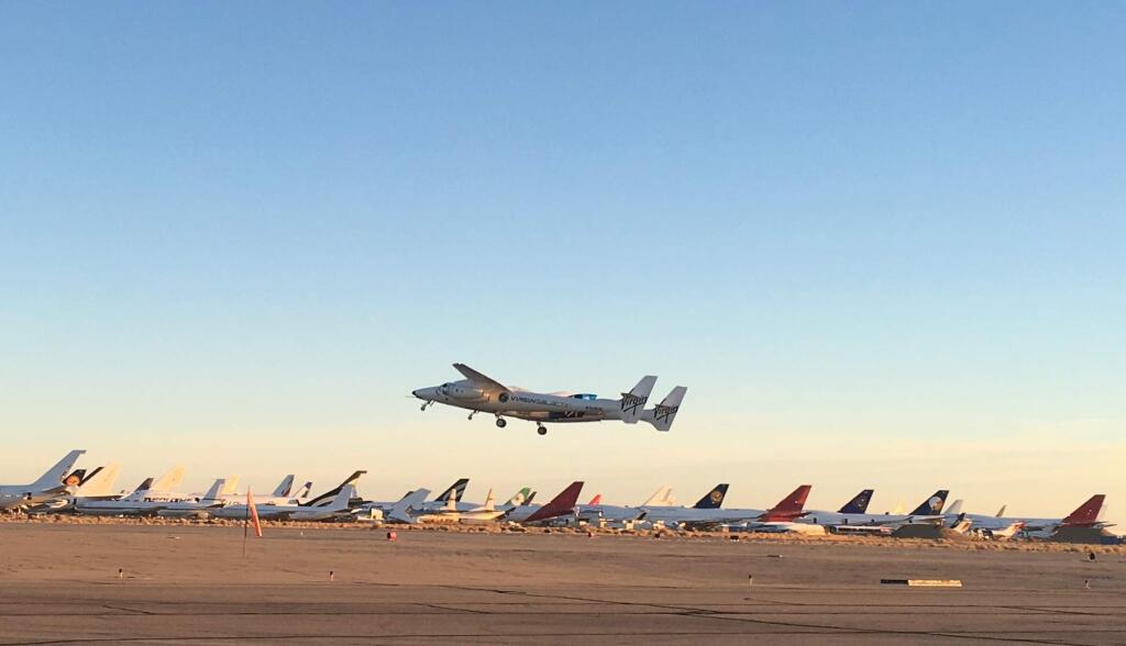 A jet carrying Virgin Galactic's tourism spaceship has taken off from Mojave Air and Space Port on Thursday, Dec. 13, 2018 in Mojave, Calif. The jet will climb to an altitude near 43,000 feet and then release Virgin Space Ship Unity.The pilots hope to fly the rocket ship to an altitude exceeding 50 miles (80 kilometers), which Virgin Galactic considers the boundary of space. (AP Photo/John Antczak)