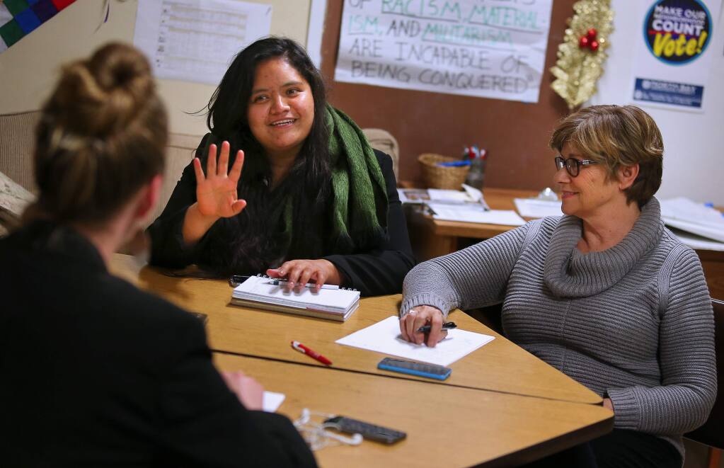 North Bay Organizing Project voter engagement leaders Ana Lugo, center, and Deborah Mason, right, meet with voter engagement organizer Annie Dobbs-Kramer during a subcommittee meeting in Santa Rosa, on Friday, January 22, 2016. (Christopher Chung/ The Press Democrat)