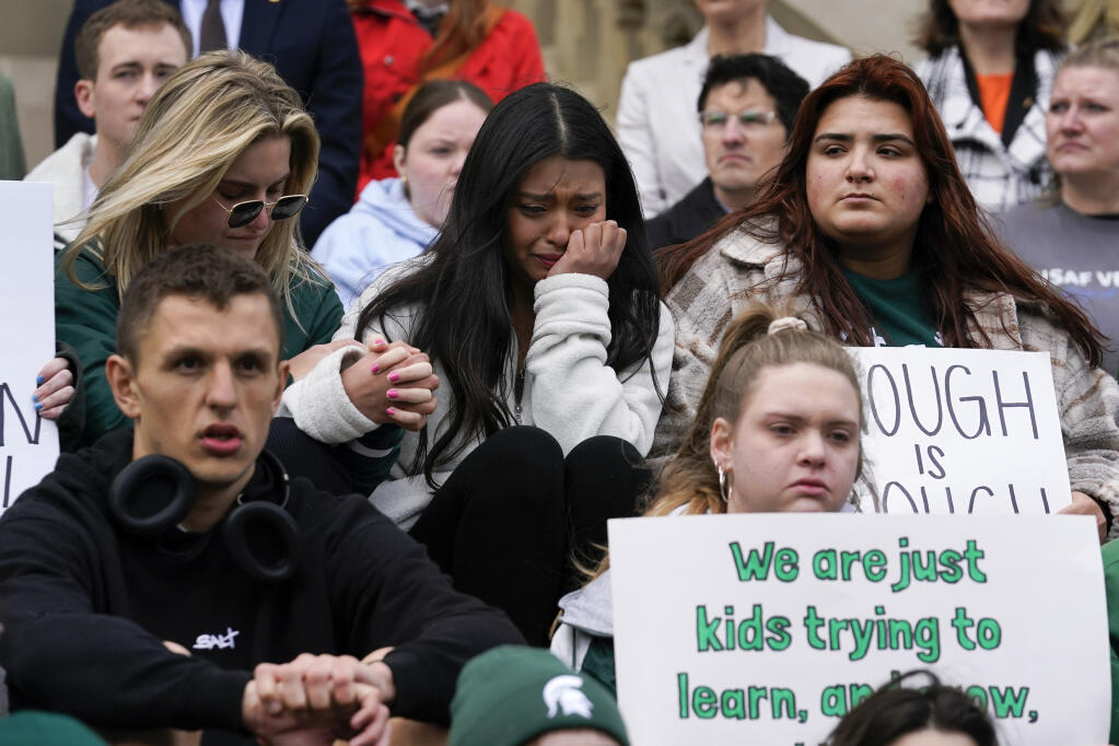 Current and former Michigan State University students rally at the capitol in Lansing, Mich., Wednesday, Feb. 15, 2023. Alexandria Verner, Brian Fraser and Arielle Anderson were killed and other students remain in critical condition after a gunman opened fire on the campus of Michigan State University Monday night. (AP Photo/Paul Sancya)