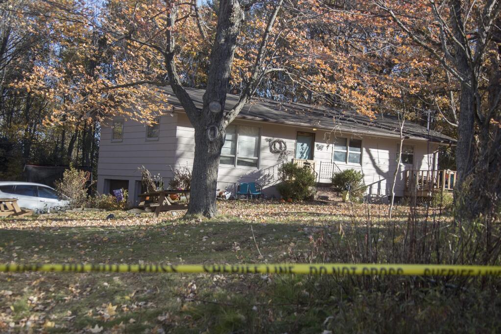 Barron County Sheriff's remained at the scene of the home where 13-year-old Jayme Closs lived with her parents James, and Denise Wednesday Oct. 17, 2018 in Barron, Wis. Investigators have been searching for 13-year-old Jayme Closs since deputies responding to a 911 call early Monday found her parents dead in their home in Barron. The girl, who was ruled out as a suspect on the first day, was gone when deputies arrived. (Jerry Holt/Star Tribune via AP)