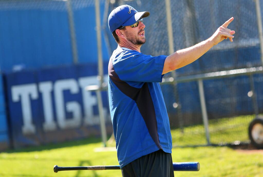 Analy head baseball coach Jeff Ogston calls out instructions to his players during practice, in Sebastopol, on Wednesday, April 6, 2016. (Christopher Chung / The Press Democrat)