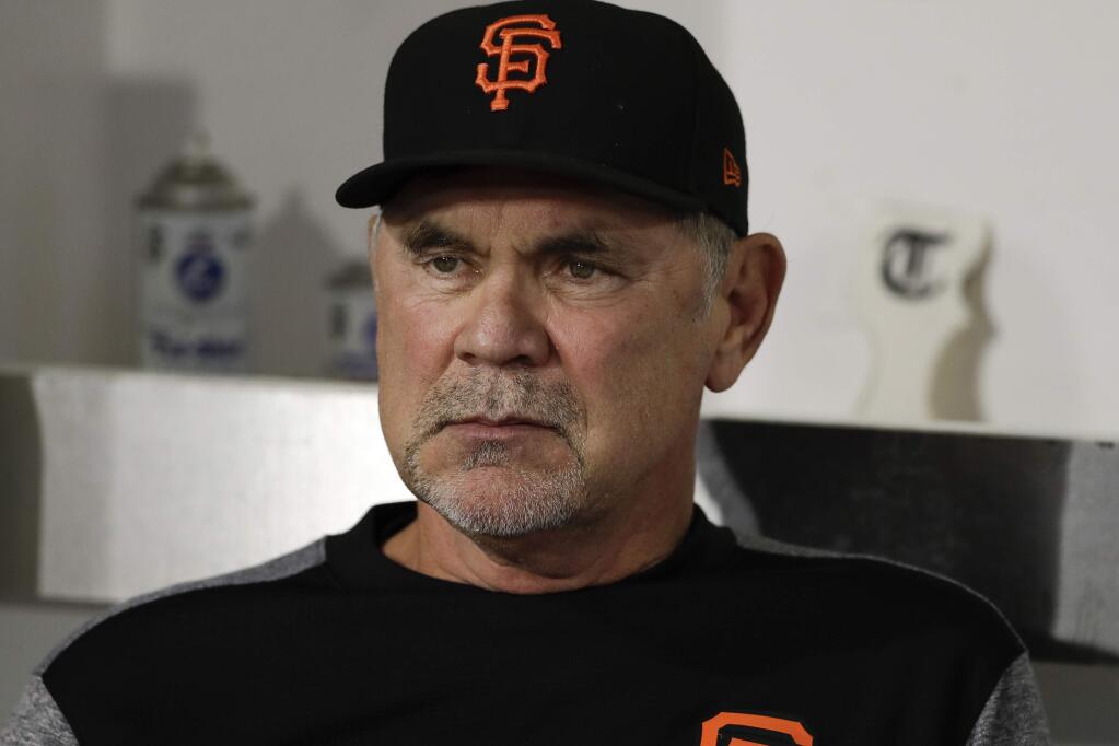 San Francisco Giants manager Bruce Bochy looks on before a game against the San Diego Padres Monday, Sept. 17, 2018, in San Diego. (AP Photo/Gregory Bull)