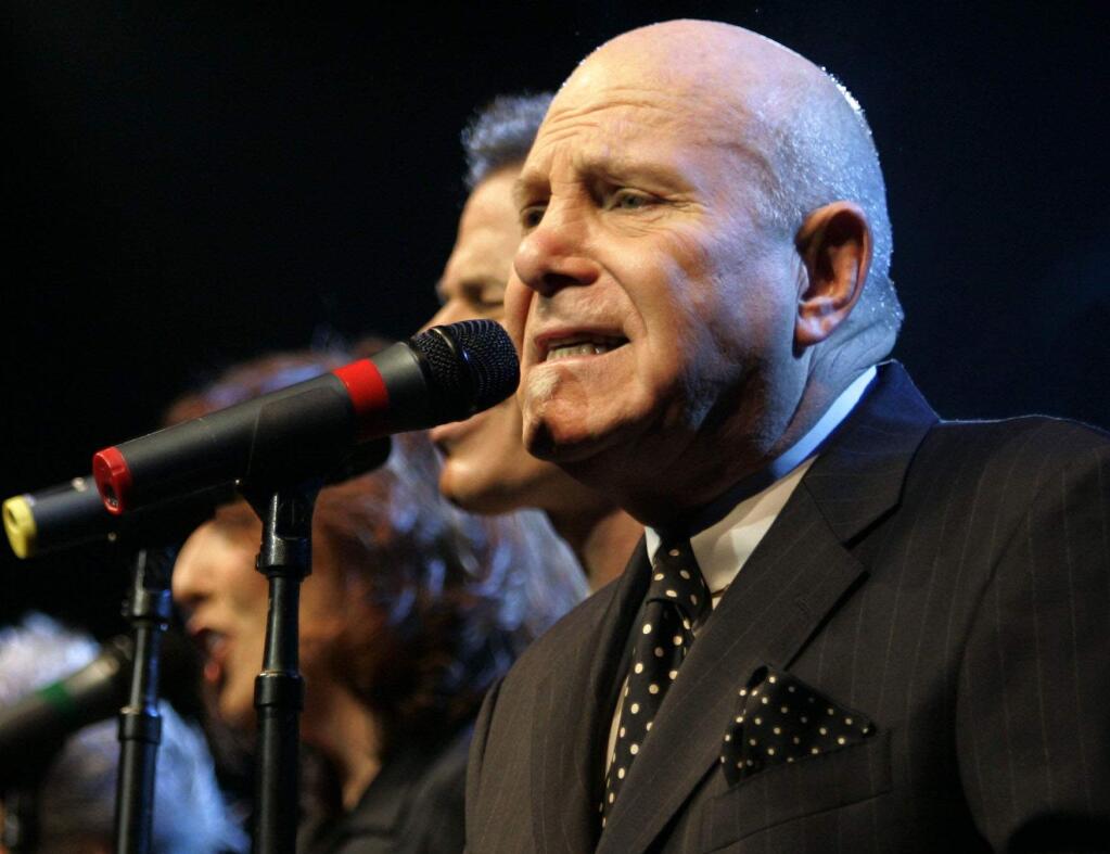 FILE - In this Nov. 8, 2006 file photo, Tim Hauser, right, performs with the other members of the U.S. vocal group The Manhattan Transfer at the Avo Session in Basel, Switzerland. Hauser, the founder and singer of the Grammy-winning vocal troupe The Manhattan Transfer, died Thursday from cardiac arrest, band representative JoAnn Geffen said Friday. He was 72. (AP Photo/Keystone, Georgios Kefalas, File)