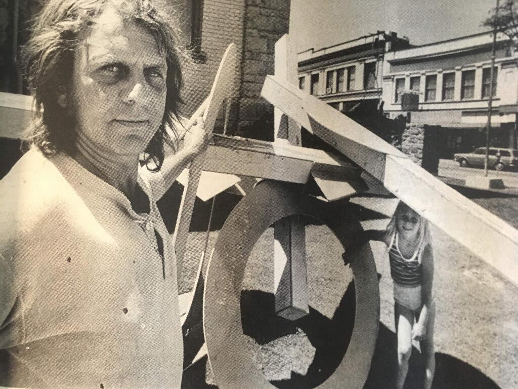 The late sculptor Guy Scohy, in 1982, with one of the public art pieces that had some locals thinking the river had just been dredged again.PHOTO BY BRANT WARD
