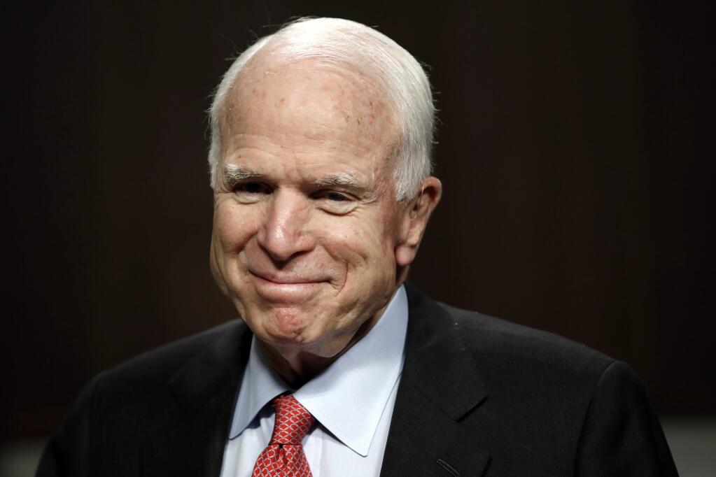 FILE - In this July 11, 2017, file photo, Sen. John McCain, R-Ariz., arrives on Capitol Hill in Washington. The office of Sen. John McCain says the ailing Arizona Republican will return to the Senate on July 25, the day of the health care vote. (AP Photo/Jacquelyn Martin, File)