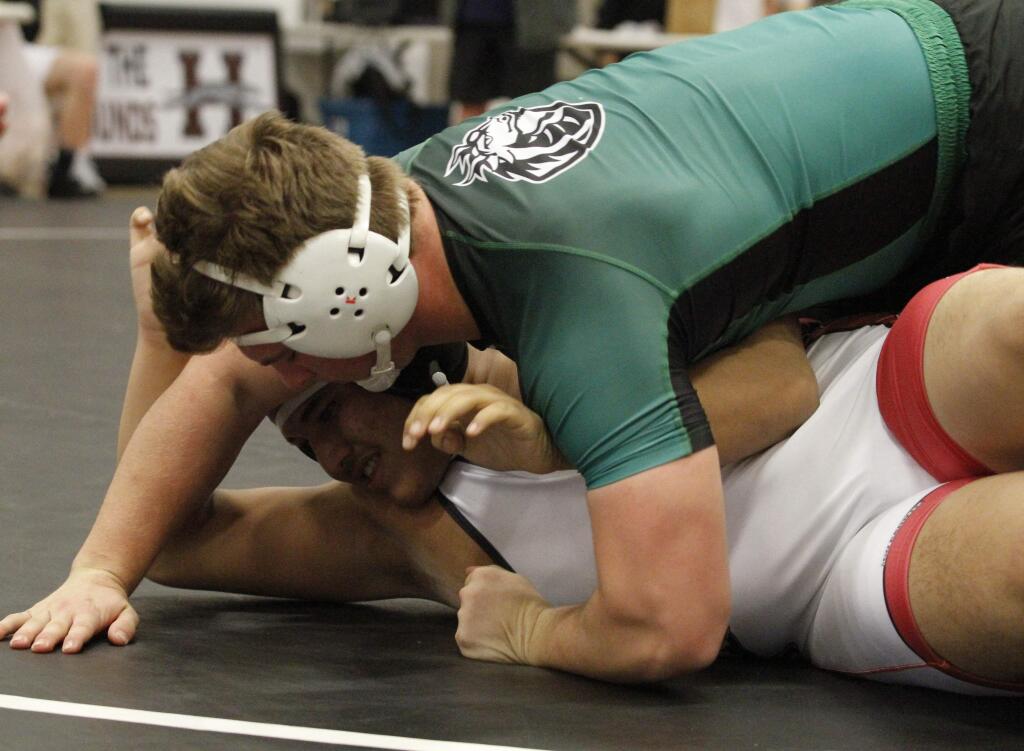 Bill Hoban/Index-TribuneSonoma's Tyler Winslow gets ready to pin his opponent Saturday in the Sonoma County League wrestling tournament in Healdsburg. Winslow won the 222-pound class as the Dragons finished second to Petaluma. Nine Dragons, including Winslow, qualified for Saturday's North Coast Section Tournament at James Logan High in Hayward.