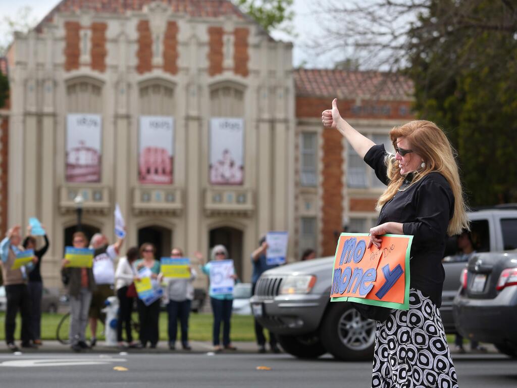 Santa Rosa school teachers demonstrating in front of Santa Rosa High School on March 20. Teachers are seeking a pay increase and restoration of health insurance benefits. (CHRISTOPHER CHUNG / The Press Democrat)