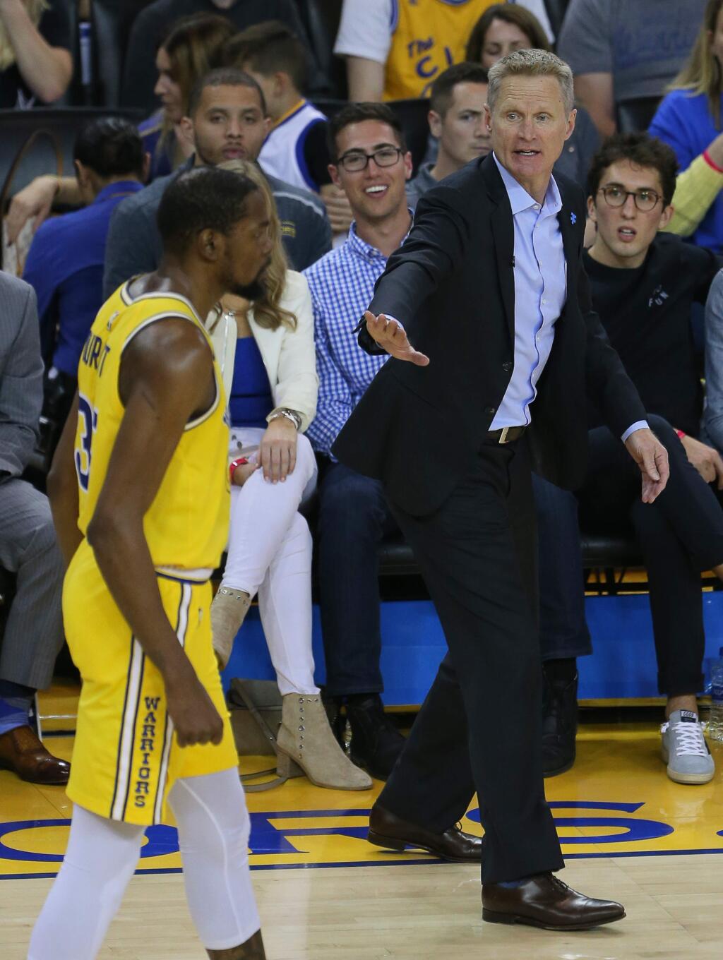 Warriors coach Steve Kerr tries to calm down Kevin Durant during their game against the Denver Nuggets in Oakland on Tuesday, April 2, 2019. Durant was ejected from the game. (Christopher Chung / The Press Democrat)