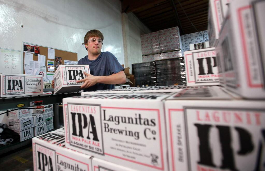 4/11/2012: C6:PC: Patrick Sharyon stacks boxes of Lagunitas Brewing Co. IPA at the Petaluma facility, April 10, 2012.