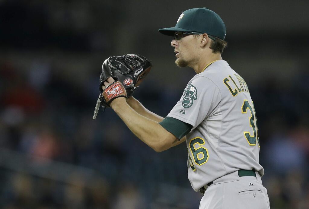 Oakland Athletics relief pitcher Tyler Clippard prepares to throw during the ninth inning of a baseball game against the Detroit Tigers, Tuesday, June 2, 2015, in Detroit. (AP Photo/Carlos Osorio)