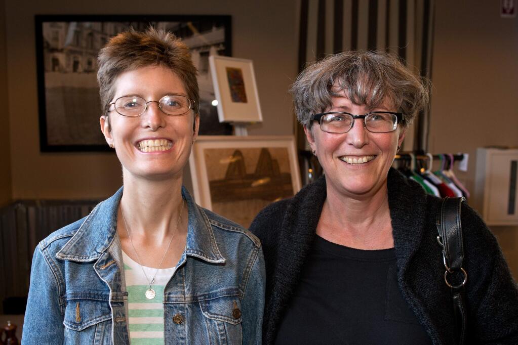 Becoming Independent artist Alison Koehler, left, and Sue Brady attend Becoming Independent's Pop-up Art Show at Rosso Rosticceria + Eventi in Santa Rosa, California, on August 28, 2014. (Alvin Jornada / For The Press Democrat)
