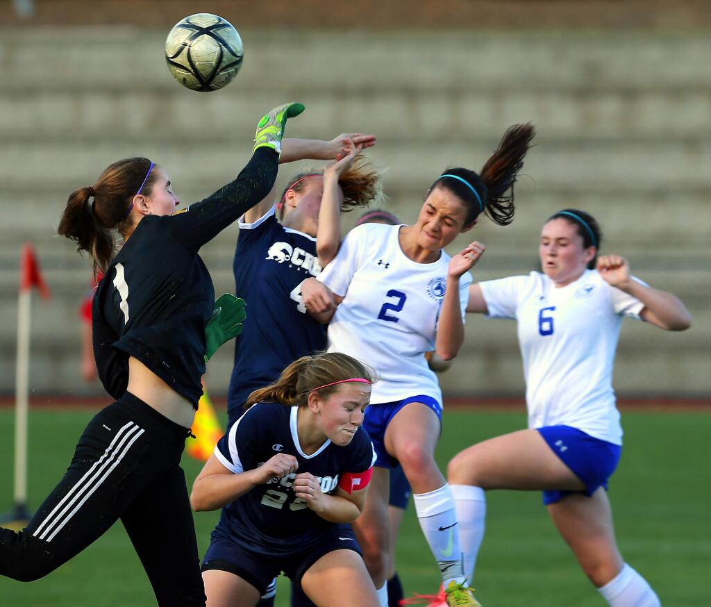 St. Vincent's Katie Goss, No. 2, and Emma Riley, No. 6, battle Credo keeper Lena Emerson for a crossing corner kick in the first half. St. Vincent beat No. 3 seed Credo High School, 4-0, to win the North Coast Section Division 3 girls championship on Saturday. (John Burgess / The Press Democrat)