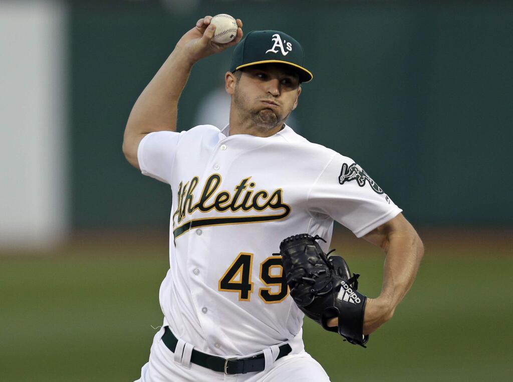 Oakland Athletics pitcher Kendall Graveman works against the Houston Astros during the first inning of a baseball game Friday, April 14, 2017, in Oakland, Calif. (AP Photo/Ben Margot)