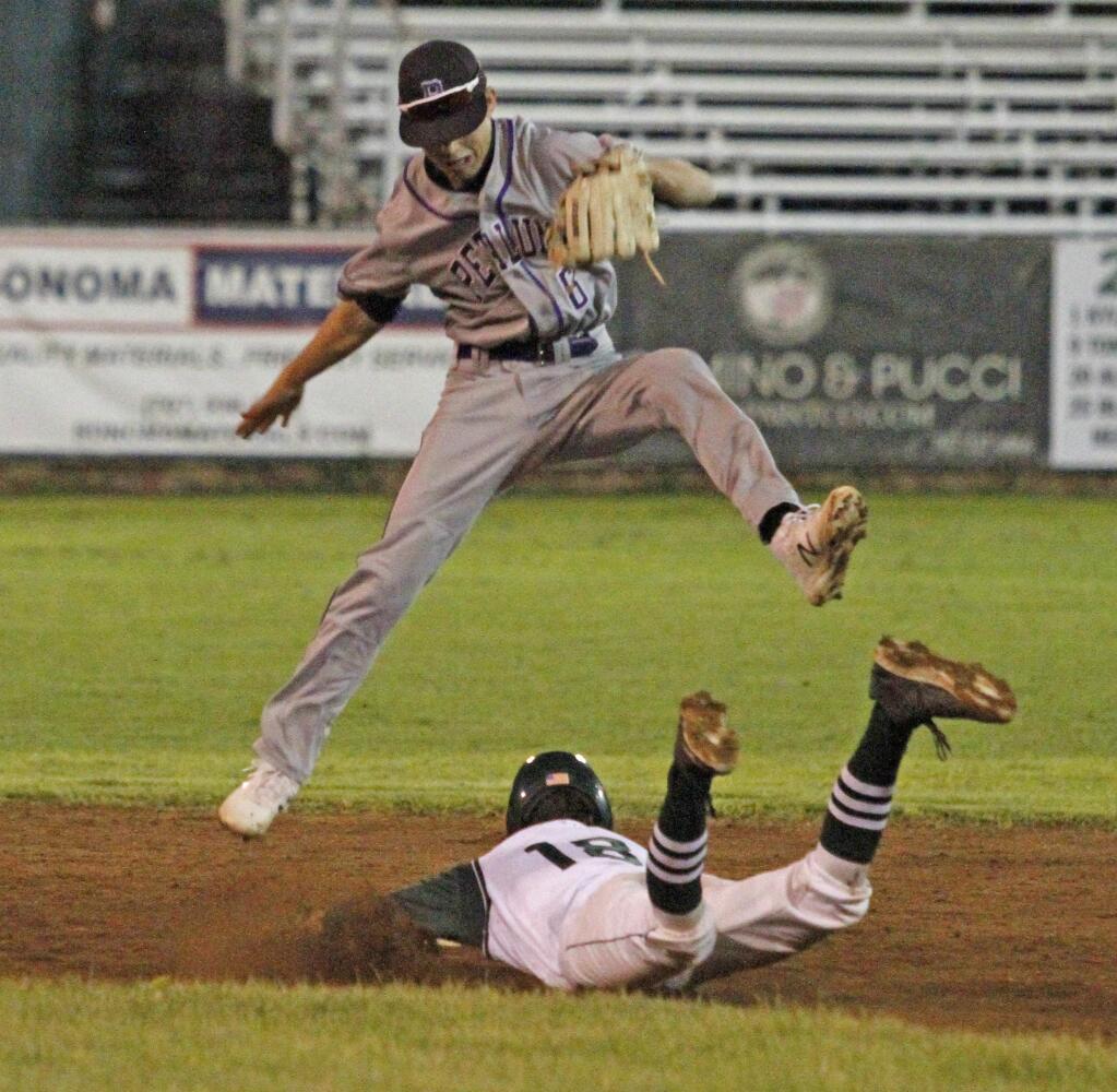 Bill Hoban/Index-TribuneSonoma's Jeremy Mackling forces the Petaluma shortstop to go airborne during a slide into second in Friday night's game.