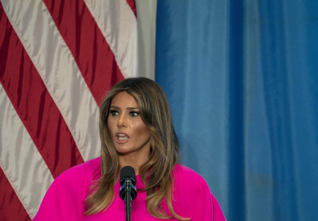 FILE - In this Sept. 20, 2017, file photo, first lady Melania Trump addresses a luncheon at the U.S. Mission to the United Nations in New York. Trump 'hates' to see families separated at the border and hopes 'both sides of the aisle' can reform the nation's immigration laws, according to a statement Sunday, June 17, 2018, about the controversy over separation of immigrant parents and children at the U.S.-Mexico border. (AP Photo/Craig Ruttle, File)