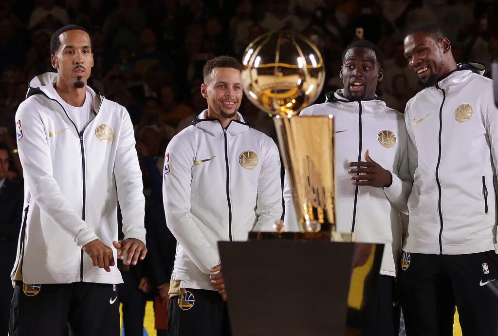 From left, Golden State Warriors' Shaun Livingston, Stephen Curry, Draymond Green, and Kevin Durant wait for their NBA championship rings during a ring ceremony prior to the basketball game against the Houston Rockets Tuesday, Oct. 17, 2017, in Oakland, Calif. (AP Photo/Ben Margot)