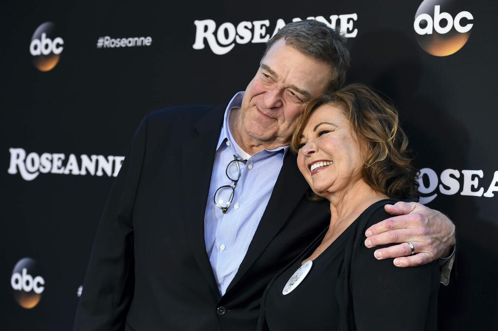FILE - In this March 23, 2018 file photo, John Goodman, left, and Roseanne Barr arrive at the Los Angeles premiere of 'Roseanne' in Burbank, Calif. (Photo by Jordan Strauss/Invision/AP, File)