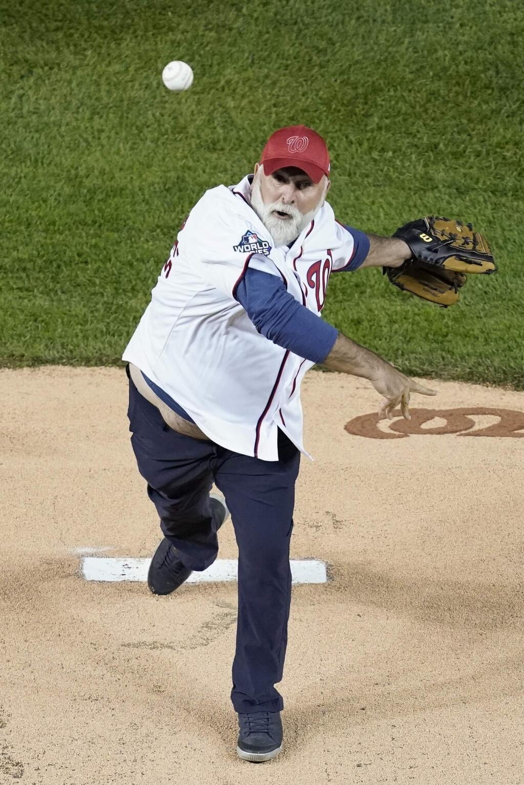 Chef José Andrés throws a ceremonial first pitch before Game 5 of the baseball World Series between the Houston Astros and the Washington Nationals Sunday, Oct. 27, 2019, in Washington. (AP Photo/Pablo Martinez Monsivais)
