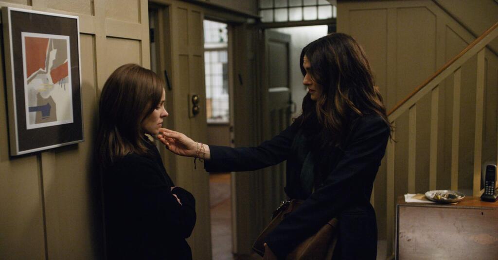 Rachel Weisz, right, plays a woman who returns to the orthodox Jewish community that shunned her decades earlier for her attraction to a childhood friend (Rachel McAdams, left). (BLEECKER STREET)