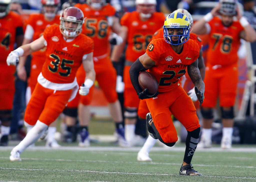 North safety Nasir Adderley, of Delaware, returns an interception during the second half of the Senior Bowl college football game, Saturday, Jan. 26, 2019, in Mobile, Ala. (AP Photo/Butch Dill)